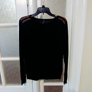 Black sweater with gold detail